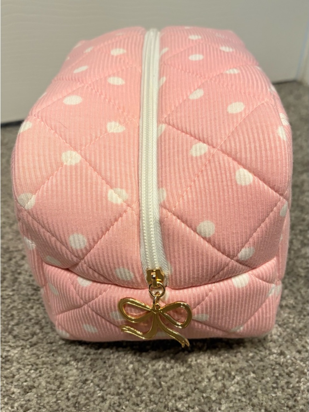 Krista Horton Staykation pink polka dot cosmetic bag with bow zipper pull